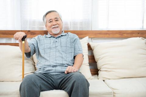 senior asian man with cane